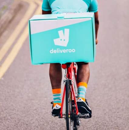 A Deliveroo rider in action.