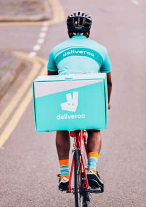 A Deliveroo rider in action.