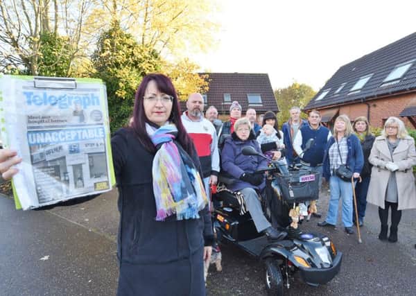 Residents of St Michael's Gate and neighbours gather for a protest against the evictions. Pictured (left) is Jelana Stevic with a petition and a copy of a PT front page EMN-161113-172443009