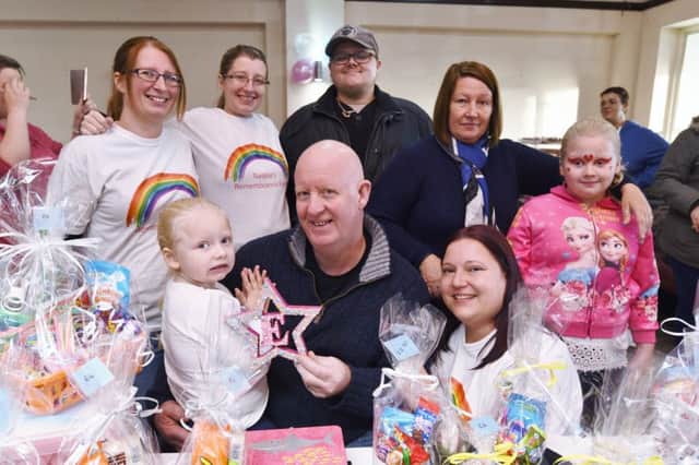 Andy Chesher and granddaughters Lilli-Mae and Brooke Taylor with organiser Sarah Shaw and  family members at the Natalie Chesher fundraiser at the Heron Pub, Stanground EMN-161113-172538009