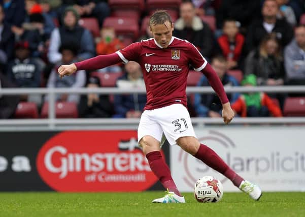 Matt Taylor will play for Cobblers against Posh.