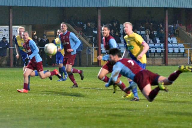 It's a diving header from Deeping Rangers' Jason Kilbride during the 4-0 win over Wellingborough. Photo: Tim Wilson.