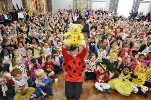 Woodston primary school  children dressing up to raise money    for Children in Need  , pictured with teacher  Laura Clingan . CIN16 EMN-161118-151307009