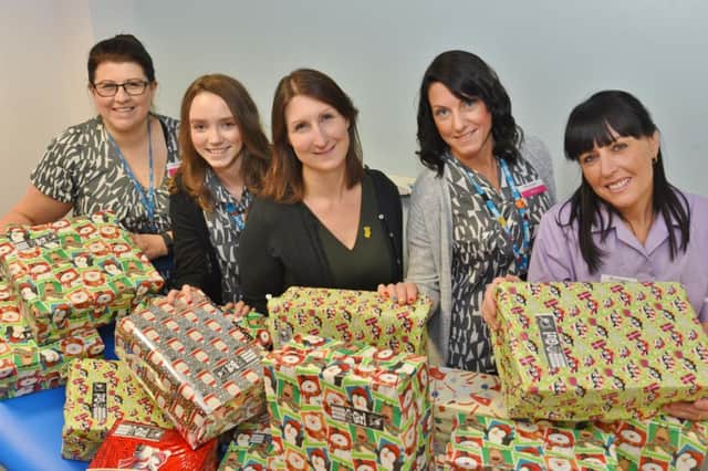 Dawn Lyons, Bryoney Mulkern, Dr Ruth Beesley, Alison Shailer and Hayley Chiarizia collecting shoe boxes for Operation Christmas Child at Boroughbury medical centre, Craig Street . EMN-161118-151220009