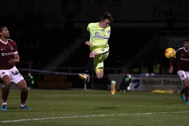 Posh skipper Chris Forrester heads the winning goal at Northampton. Photo: Joe Dent/theposh.com