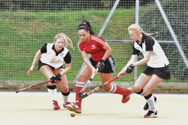 Tierney Augustine (red) scored three times for City of Peterborough over the weekend.
