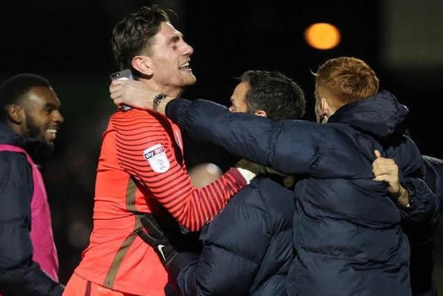 Posh goalkeeper Luke McGee celebrates victory at Northampton on Saturday. Photo: Sharon Lucey.
