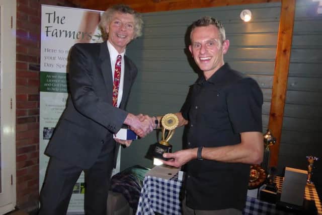 Paul Vernon (right) receives one of his five trophies from PACTRAC chairman Steve Hope.