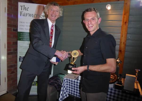 Paul Vernon (right) receives one of his five trophies from PACTRAC chairman Steve Hope.