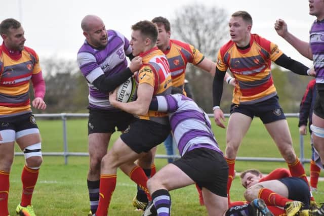 Borough fly-half Tom Williams is collared by Stamfords Austin Schwarz. Picture: Kevin Goodacre