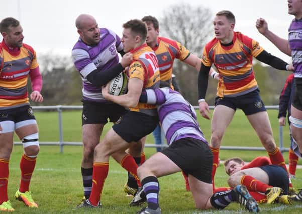 Borough fly-half Tom Williams is collared by Stamfords Austin Schwarz. Picture: Kevin Goodacre