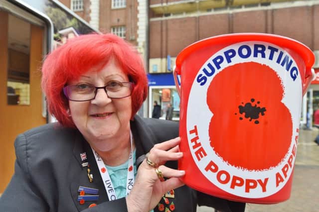 Red haired Poppy collector Catherine Bennett. EMN-160111-154802009