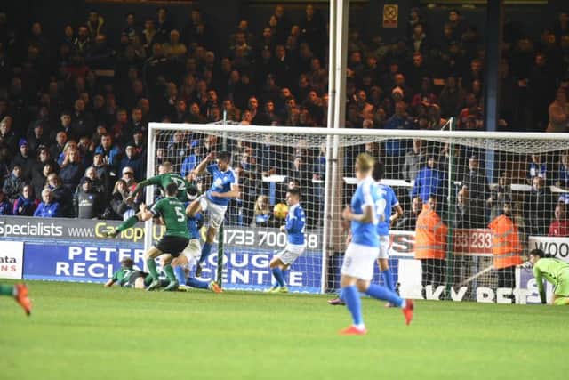 Neal Bishop bundles home Scunthorpe's second goal. Photo: David Lowndes.