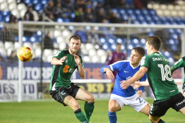 Posh striker Tom Nichols is surrounded by Scunthorpe defenders. Photo: David Lowndes.