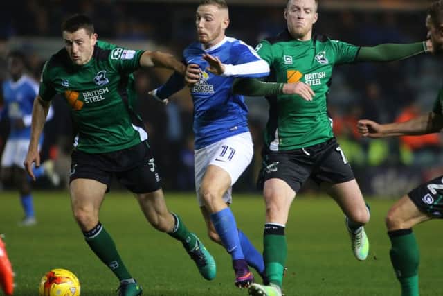 Posh star Marcus Maddison is crowded out by Scunthorpe players Neal Bishopp and Murray Wallace. Photo: Joe Dent/theposh.com.
