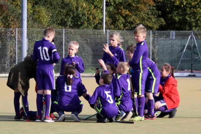 Time for a team-talk during the mixed hockey tournament at Bretton Gate.