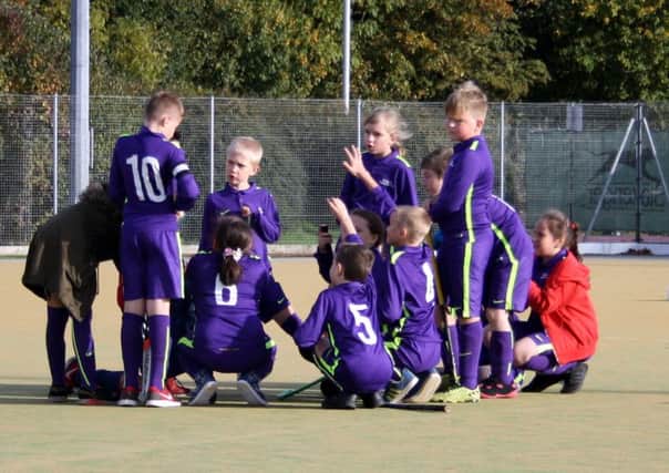 Time for a team-talk during the mixed hockey tournament at Bretton Gate.