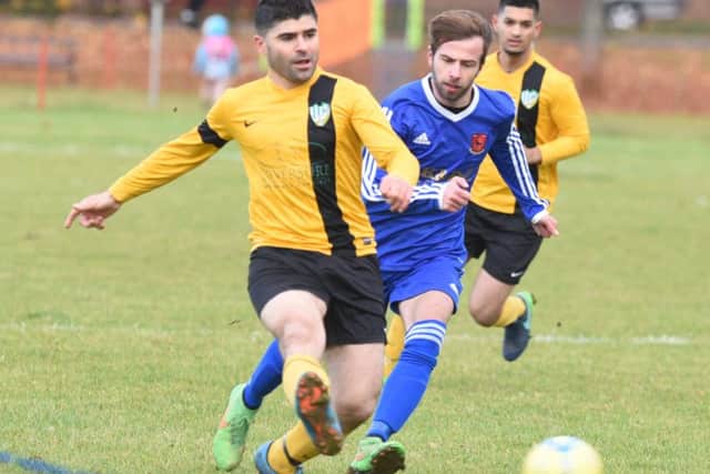 Action from FC Peterborough's 2-1 win over Brotherhood Sports (blue). Photo: David Lowndes.