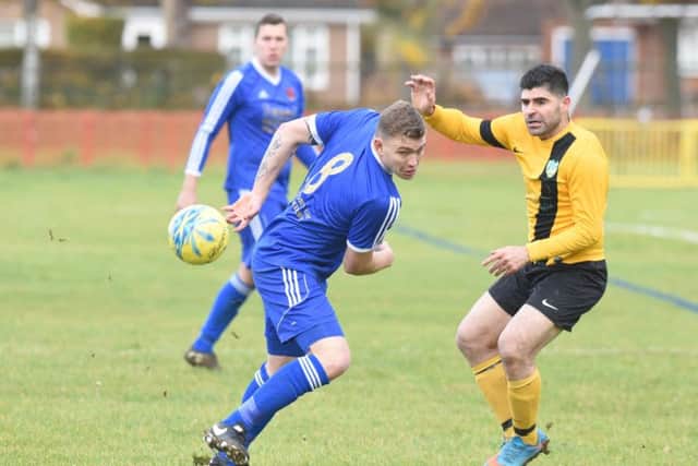 Action from the Peterborough League Division Three match between FC Peterborough and Brootherhood Sports (blue). Photo: David Lowndes.