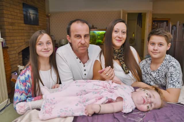 Sarah   Costigan of Yaxley with her terminally ill baby  Amelia-Rose (18 months-old) and children Sophie (10) and Joshua (11) EMN-161122-230831009