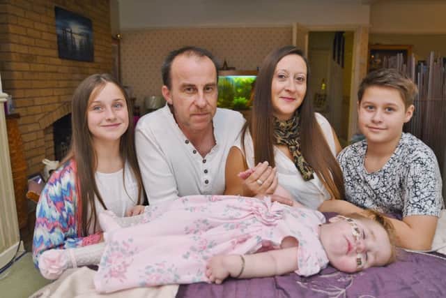 Sarah Costigan of Yaxley with her terminally ill baby Amelia-Rose (18 months-old) and children Sophie (10) and Joshua (11) EMN-161122-230831009