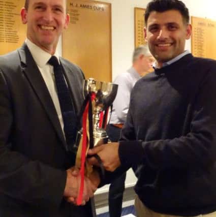Bashrat Hussain of Oundle receives the John Wilcox Cup.