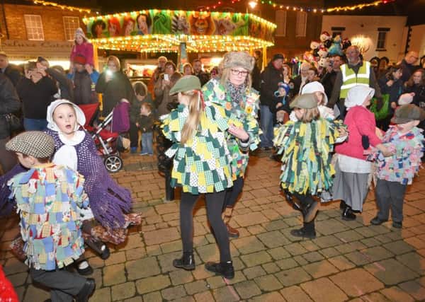 Whittlesey Christmas Extravaganza at the Market Place. Pupils from New Road primary school molly dancing EMN-151212-232856009