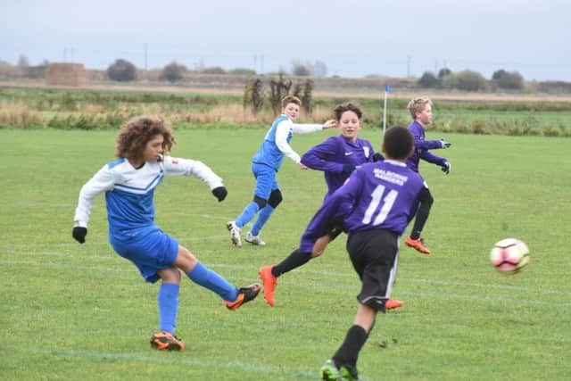Action from the Under 13 game between Malborne Rangers  and Yaxley Black.