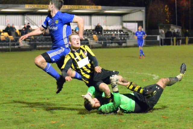 Holbeach were awarded a penalty against Peterborough Sports after this incident. Photo: Tim Wilson.