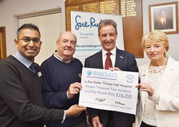 Nilesh, Dave, Rob and Carol at the cheque presentation
