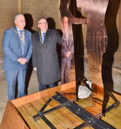 Mark Broadhead from Queensgate,   and Mayor David Sanders at the unvieling of the nativity sculpture in the  northern portico at Peterborough Cathedral which was crafted by a prisoner at HMP Peterborough EMN-161128-183240009