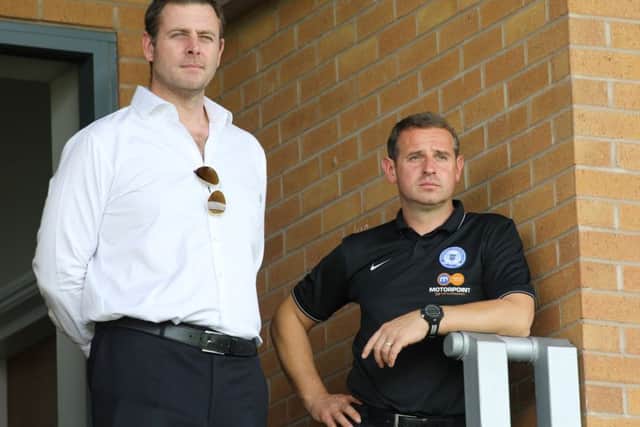 Posh chairman Darragh MacAnthony (left) with former first-team manager Dave Robertson.