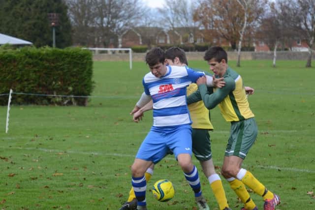Action from the Peterborough Premier Division game between Crowland (yellow) and Leverington. Leverington won 2-1. Photo: David Lowndes.