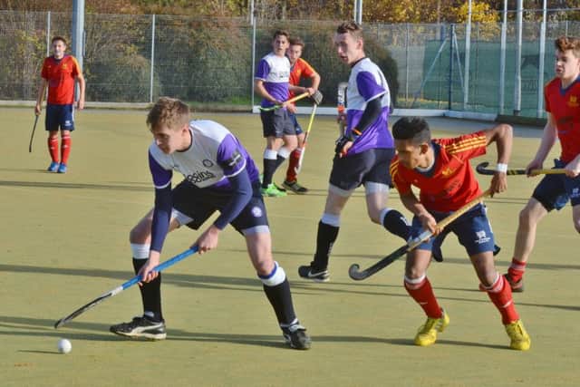 Action from City of Peterborough (red) v Old Loughtonians. Photo: David Lowndes.