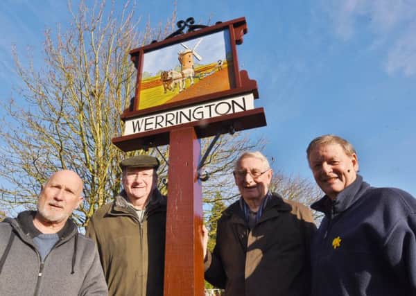 New Werrington Village sign installed on the village green. Pictured Ron McKenna, Vince Moon, Rod Boulton and Geoff Smith EMN-161126-164711009