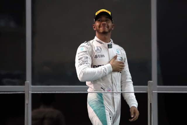 Smug Lewis Hamilton.