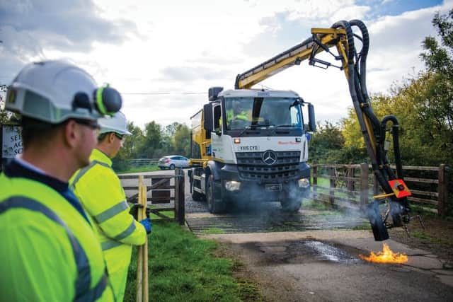 The 'dragon' pothole patcher