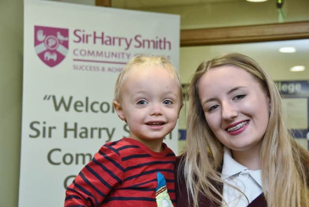 Yazmin Hills , a pupil of SHSCC Whittlesey, having her head shaved to raise funds for Cody Stanier (3) by hairdresser and mum Claire Hills. EMN-161125-152631009