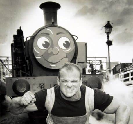 Britain's Strongest Man Adrian Smith attempts to pull Thomas the Tank Engine ENGEMN00120101229174548