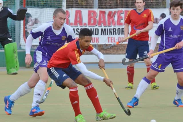 Manish Patel (red) in action for City of Peterborough against Saffron Walden. Photo: David Lowndes.