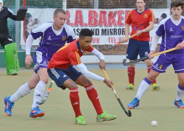 Manish Patel (red) in action for City of Peterborough against Saffron Walden. Photo: David Lowndes.