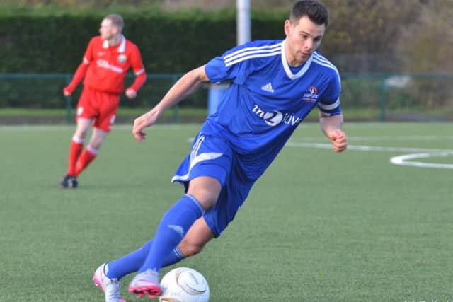 Yaxley's Dan Cotton in action at Harborough at the weekend when he scored his 100th goal for the club.
