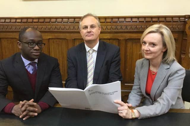Justice Minister Sam Gyimah and Secretary of State Liz Truss with Peterborough MP Stewart Jackson and the document outlining the new proposals