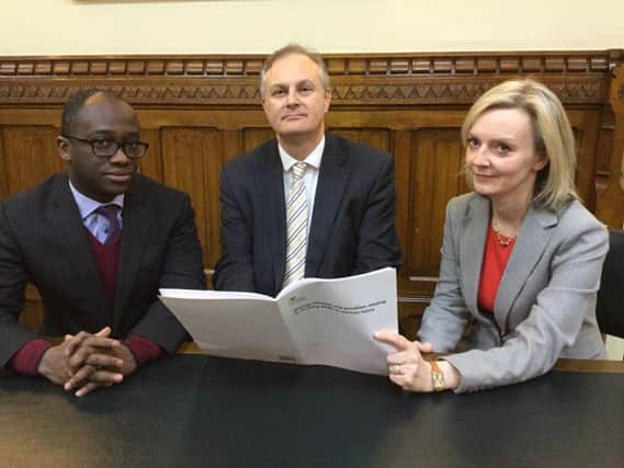 Justice Minister Sam Gyimah and Secretary of State Liz Truss with Peterborough MP Stewart Jackson and the document outlining the new proposals