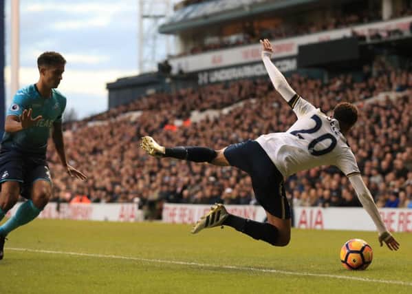 Dele Alli flies through the air with the greatest of ease.