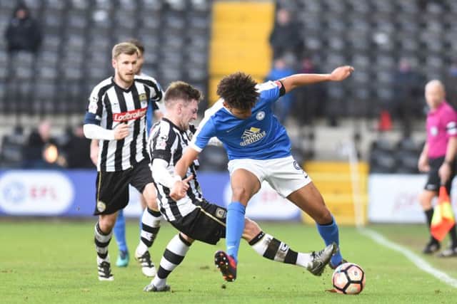 Posh striker Lee Angol was sent off at Notts County after tangling with a home player.