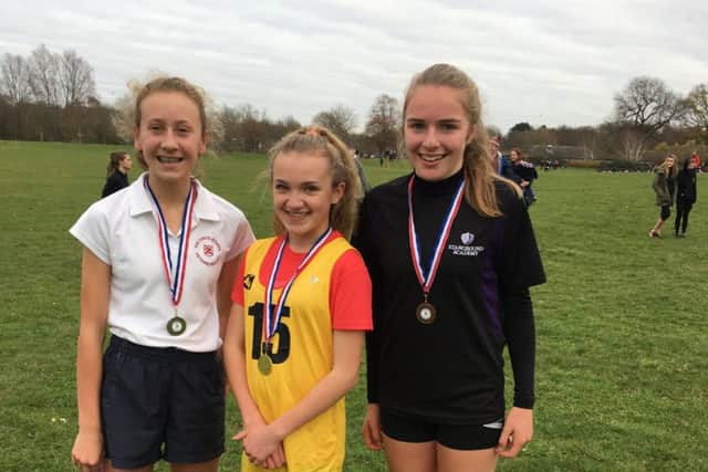 The first three home in the junior girls race were from the left Katie Tasker, Ella Robinson and Elizabeth Taylor.