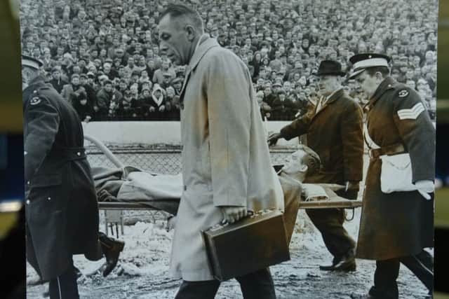 Posh player Vic Crowe is stretchered off at Stamford Bridge in 1965.