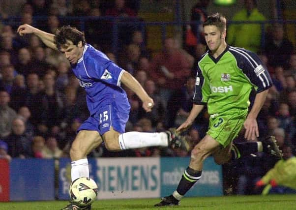Posh star Adam Drury chases Chelsea's Gianfranco Zola during an FA Cup tie at Stamford Bridge in 2001.