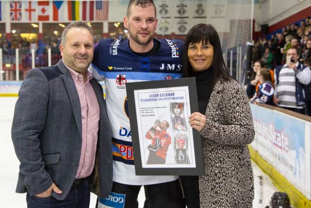 Jason Buckman with club owners David and Jo Lane after announcing his retirement last season.